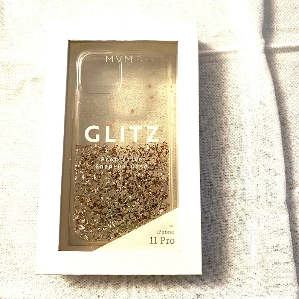 Cell phone cover fits iPhone 11 MVMT Glitz. Won’t slip out of your hand. NWT